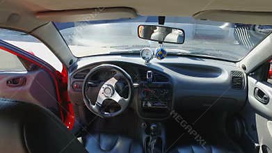 View from inside of expensive sports car with leather interior and turbo force