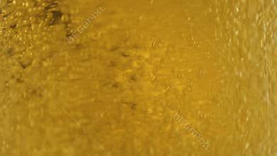 Fresh light cider pouring in glass close-up, degustation, drink fermentation