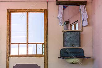 Nostalgic Charm: Vintage House Interior with Old Water Tank Sink