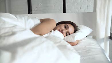 Happy Woman Waking Up In Comfortable Bed With White Linens
