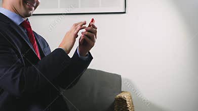 A man using his smartphone. looking through erotic content. he flirts talking on video