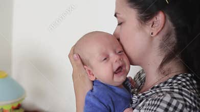 Mom comforts a crying baby