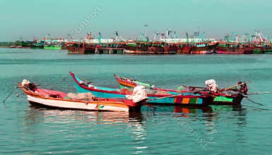 The big and small boats parked in the river arasalaru to ready to catch fish.