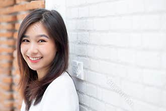 Portrait of beautiful young asian woman happiness standing on gr