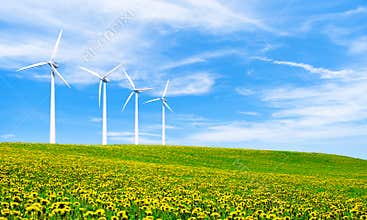Renewable energy with wind turbines. Wind turbine in green hills.