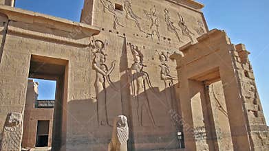 Hieroglyphic carvings and columns at an ancient egyptian temple