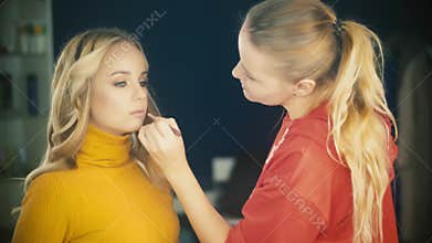 Backstage of working make up artist.