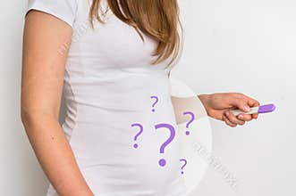 Woman with imagination of a pregnant belly - infertility concept