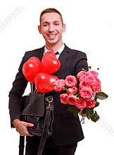 A guy with a smile stretched a bouquet forward on a white isolated background
