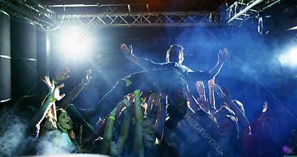 Crowd surfing at a concert 4k