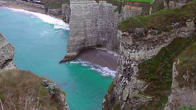 White chalk cliffs above English Channel, beautiful empty beach and azure water