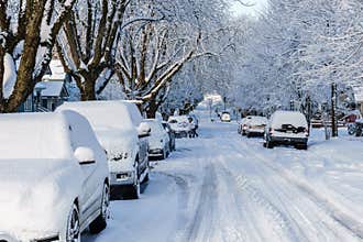 VANCOUVER, CANADA - February 24, 2018: Winter morning after a night of snow blizzard cars in snow.