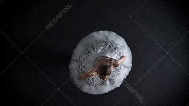 Silhouette of young elegant woman ballerina in tutu is steping and spining, ballet concept, movement concept, top shot