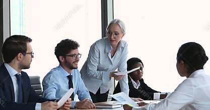 Senior business lady teacher hold seminar talk to young trainees