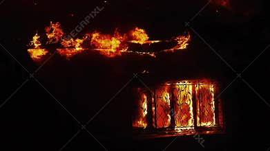 house fire. the building is on fire burning a danger smoke sparks. fire safety natural disaster concept. fire in factory