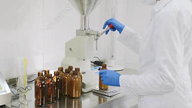 Cosmetology expert doctor chemist scientist pharmacist making medicine cosmetic in the laboratory. pouring and measure