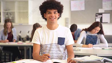 African guy thinking in class