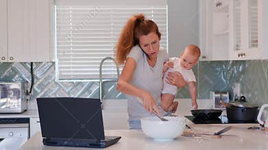 Caucasian mother working from home, having a work video call, daughter on hands. Stay home, quarantine remote work.