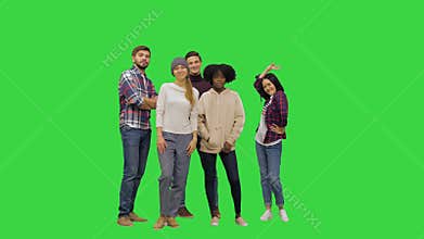 Young kids posing for a full size picture, looking funny on a Green Screen, Chroma Key.
