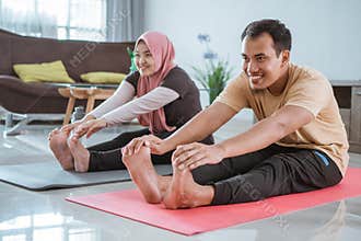 fitness couple, man and woman exercising together at home