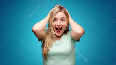 Portrait of woman shocked and surprised with good news