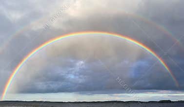 Natural double rainbows plus supernumerary bows