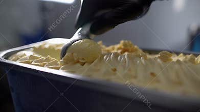 close-up spoon picking cold and delicious Italian ice cream.