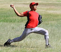 Baseball player throws the ball down the line