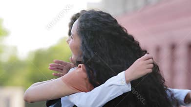 Close-up caring unrecognizable mother brunette woman mom seeing off child daughter little girl to school touches