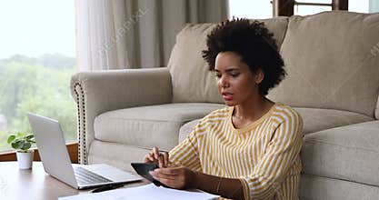 Confused black female calculate expenses hug head think of bankruptcy