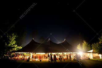 Night time wedding tent with stars visible.
