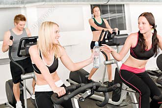 Fitness young girl on gym bike