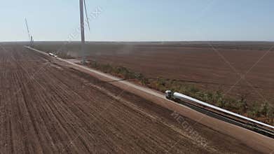 Truck transports blade for wind turbine along rural road