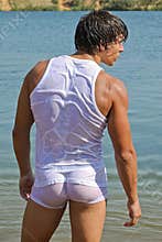 wet muscle young boy standing in water