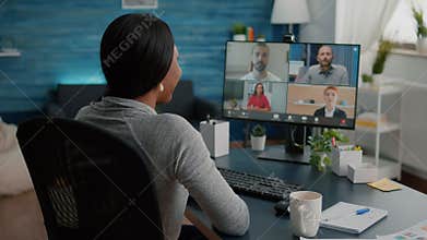 Black student discussing marketing academic ideas with college team having virtual teleconference