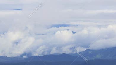 Mist is flowing through the mountain valley at Chiang Kam Mountain, Chiangmai, Thailand