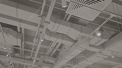 Industrial Ceiling with Exposed Ductwork and Lighting