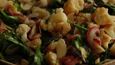 Warm Winter Salad with Cauliflower, Spinach, Red Onion, and Almonds - CloseUp