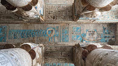 Ancient Egyptian hieroglyphs and bas-reliefs close-up in Dendera temple or Temple of Hathor. Egypt. Dendera Temple