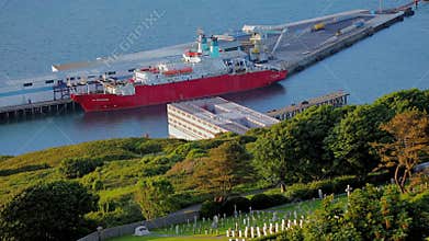 Editorial, Bibby Stockholm barge from above docked on land, used house UK asylum seekers, evening light.