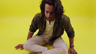 Young person sitting in asylum