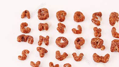 Alphabet letters from cereals on white background,