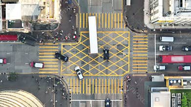 Car traffic transport on road, pedestrian people walk cross zebra crossing, crossroad junction in Mong Kok, Hong Kong downtown