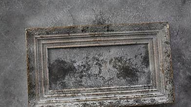Old empty wooden frame covered with ice and snow