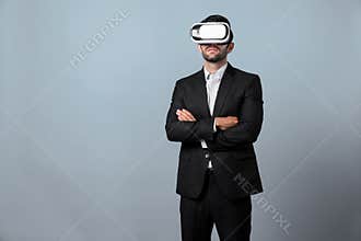 Smart business man crossing arms and standing at white background. Deviation.