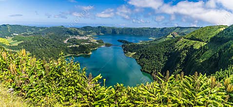 A view over the hedgerow down the length of the Green and Blue lakes on the island of San Miguel in the Azores