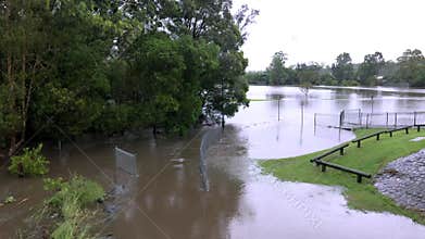 Flood water flowing into an urban park after a heavy thunderstorm.