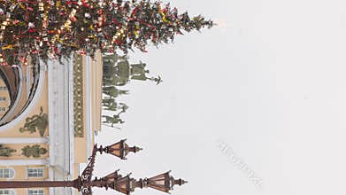 The main Christmas tree shimmers with lights of decorations, the central Palace square of the city decorated for the