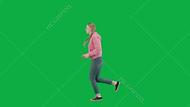 Portrait of victim on chroma key green screen background. Young girl running, scared expression, looking around, running