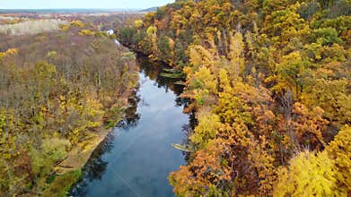Autumn aerial above river with colorful riverbanks